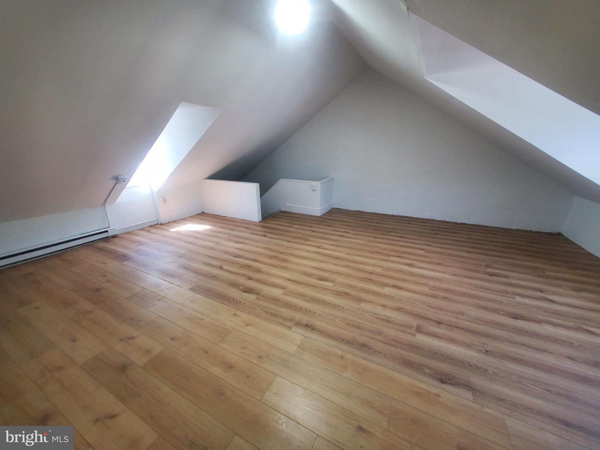 608 North 10th Street, Unit 2 Reading, PA 19604 - Photo 14 of 15 a view of an empty room and wooden floor