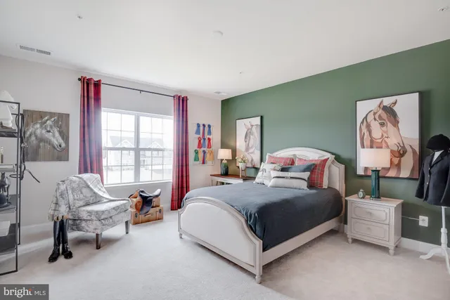 a bedroom with a bed and a couch