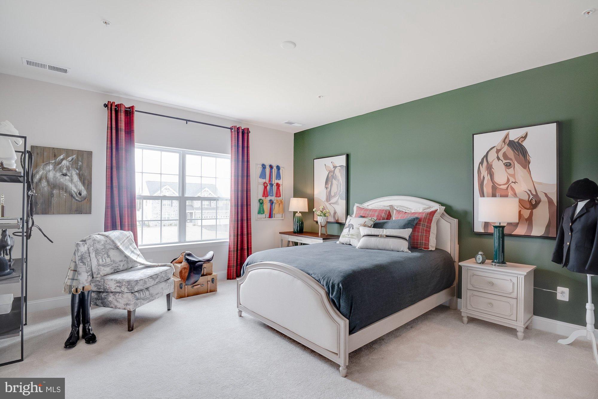 5705 Iron Stone Road Lothian, MD 20711 - Photo 11 of 17 a bedroom with a bed and a couch