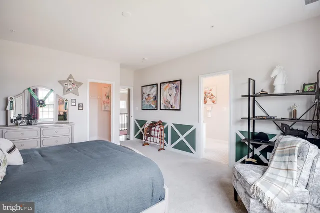 a bedroom with furniture and white walls
