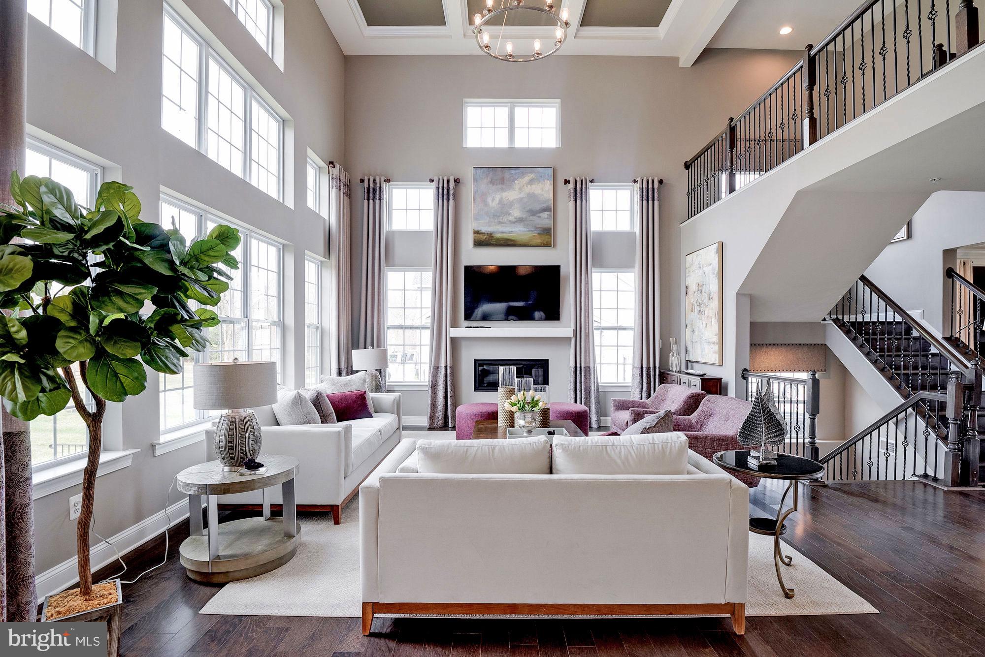 5705 Iron Stone Road Lothian, MD 20711 - Photo 15 of 17 a living room with fireplace furniture and a large window