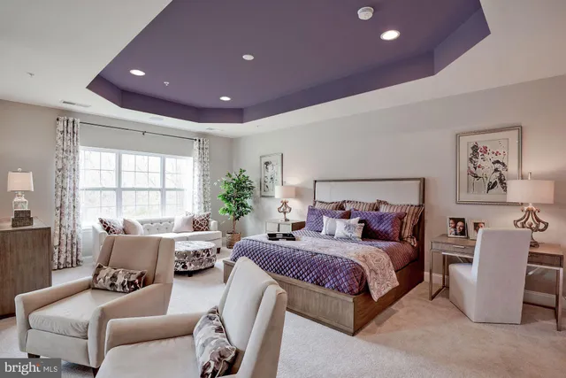 a bedroom with a bed and a couch