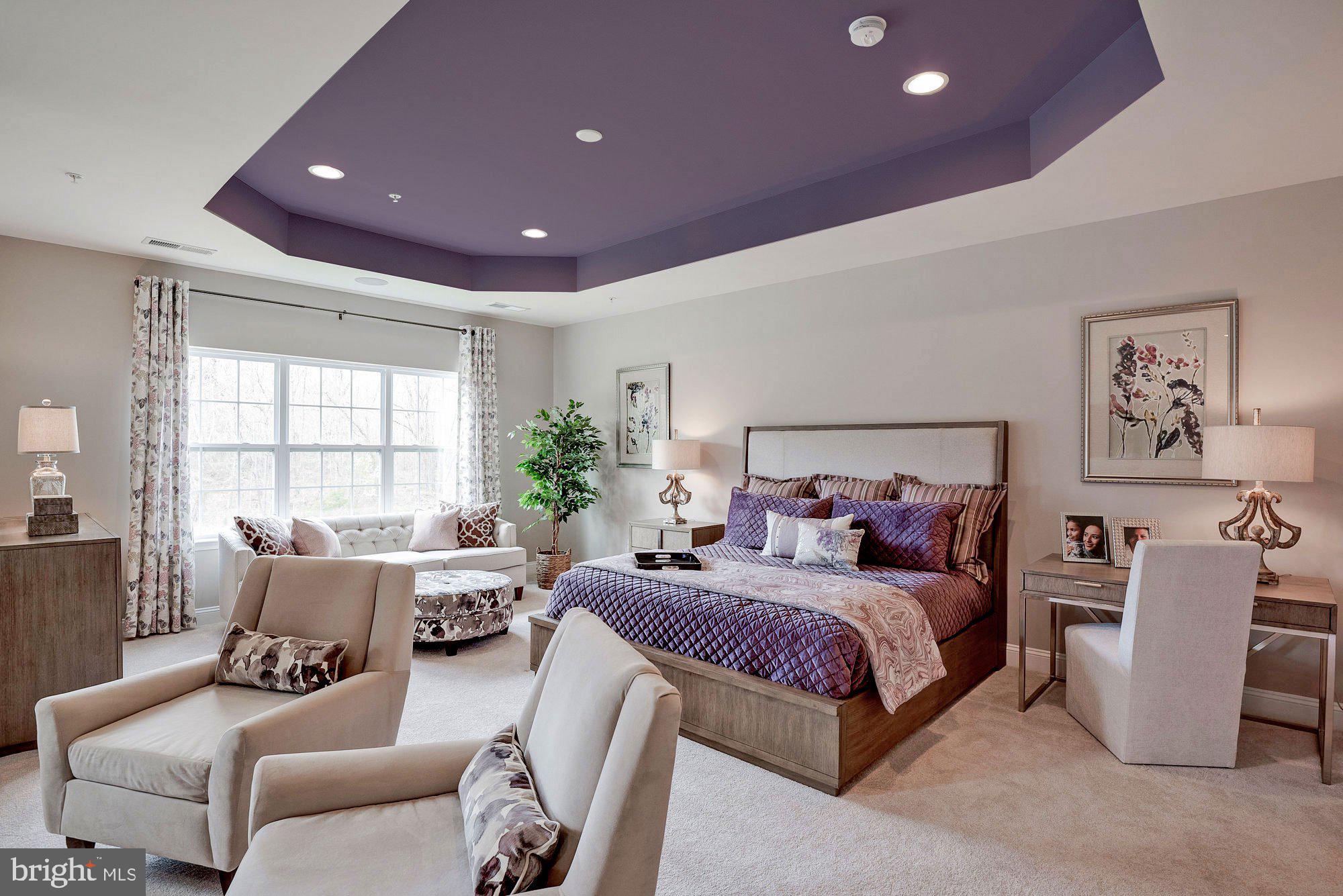 5705 Iron Stone Road Lothian, MD 20711 - Photo 6 of 17 a bedroom with a bed and a couch