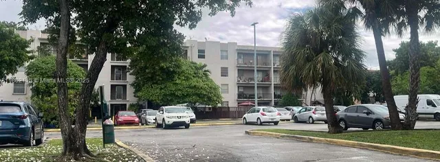 a view of a parked cars in front of a building