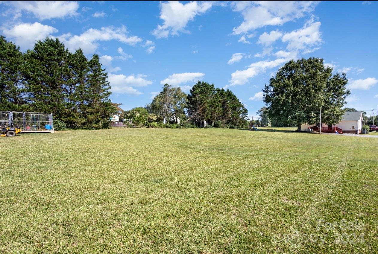 3614 White Store Road Wingate, NC 28174 - Photo 17 of 19 a view of a green field with clear sky