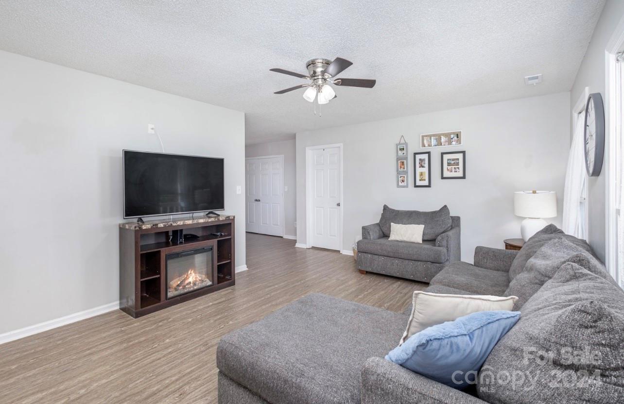 3614 White Store Road Wingate, NC 28174 - Photo 3 of 19 a living room with furniture and a flat screen tv