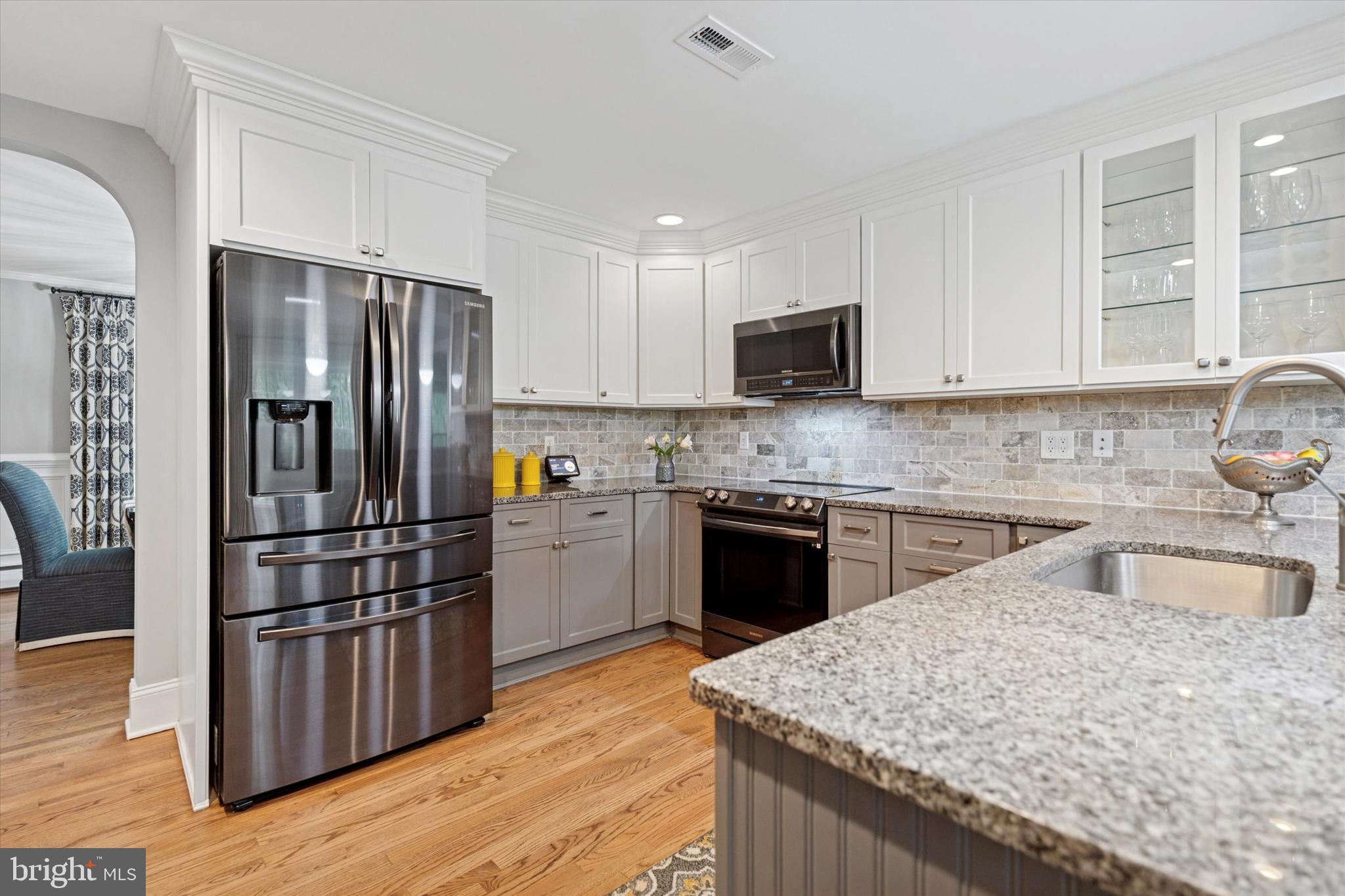 758 North Valley Forge Road Devon, PA 19333 - Photo 14 of 39 a kitchen with granite countertop a refrigerator stove top oven and sink