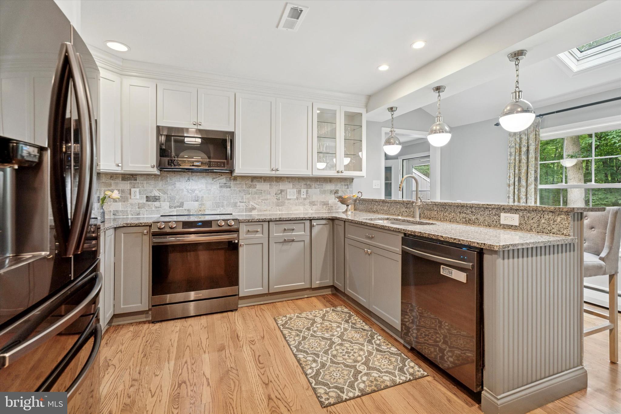758 North Valley Forge Road Devon, PA 19333 - Photo 15 of 39 a kitchen with stainless steel appliances granite countertop a stove a sink and a microwave