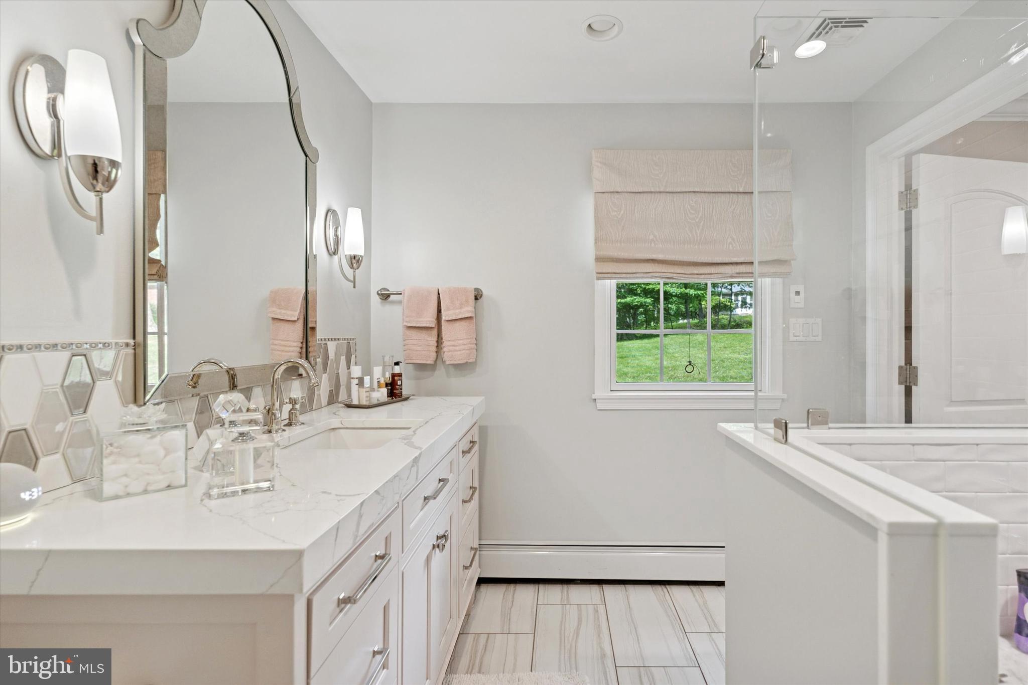 758 North Valley Forge Road Devon, PA 19333 - Photo 24 of 39 a bathroom with a double vanity sink window and a mirror