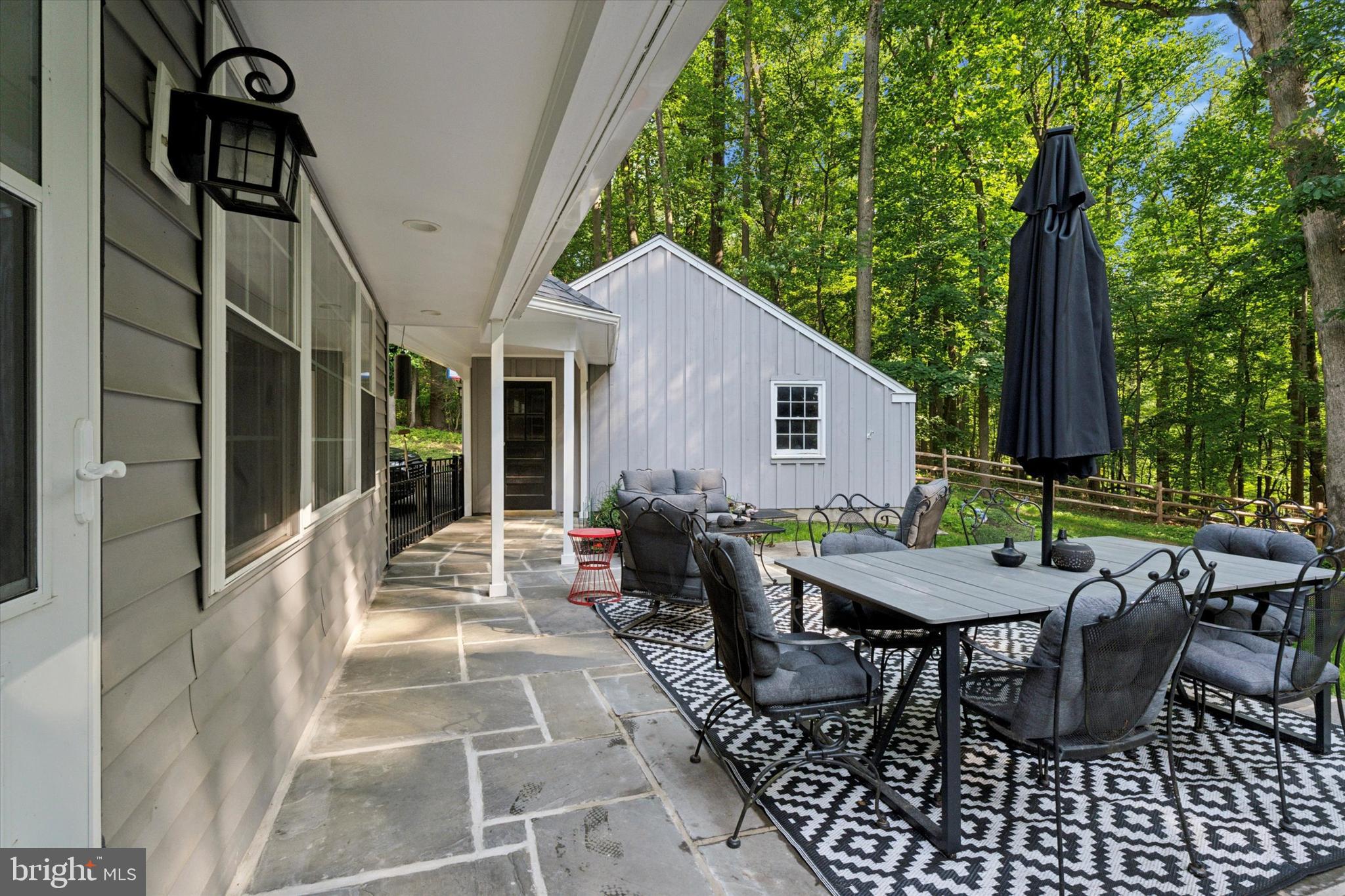 758 North Valley Forge Road Devon, PA 19333 - Photo 4 of 39 a view of a patio with table and chairs and floor to ceiling window