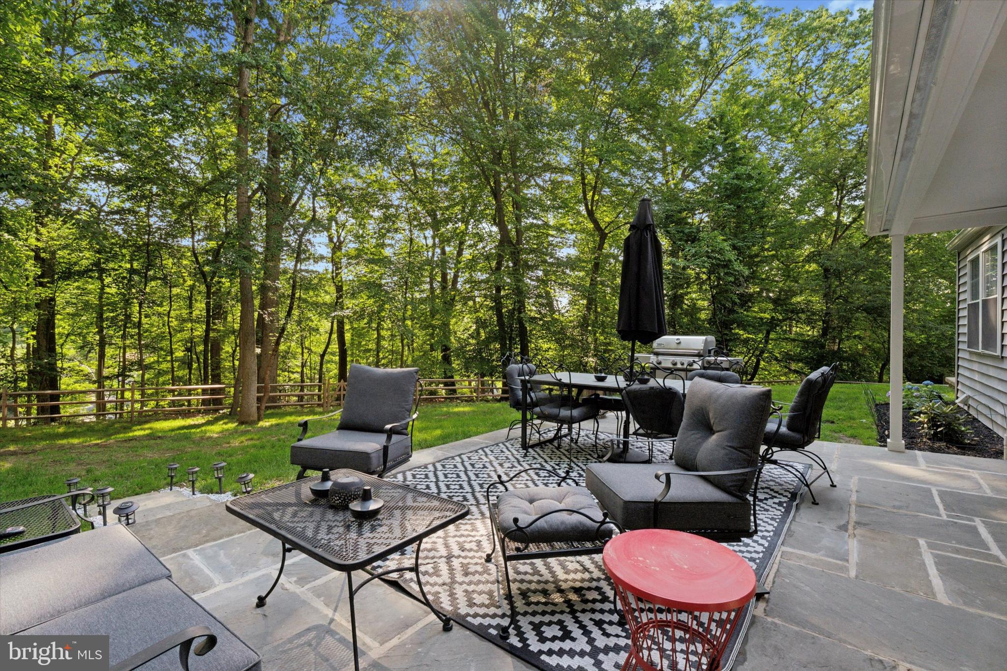 758 North Valley Forge Road Devon, PA 19333 - Photo 6 of 39 a view of a patio with couches chairs and a fire pit