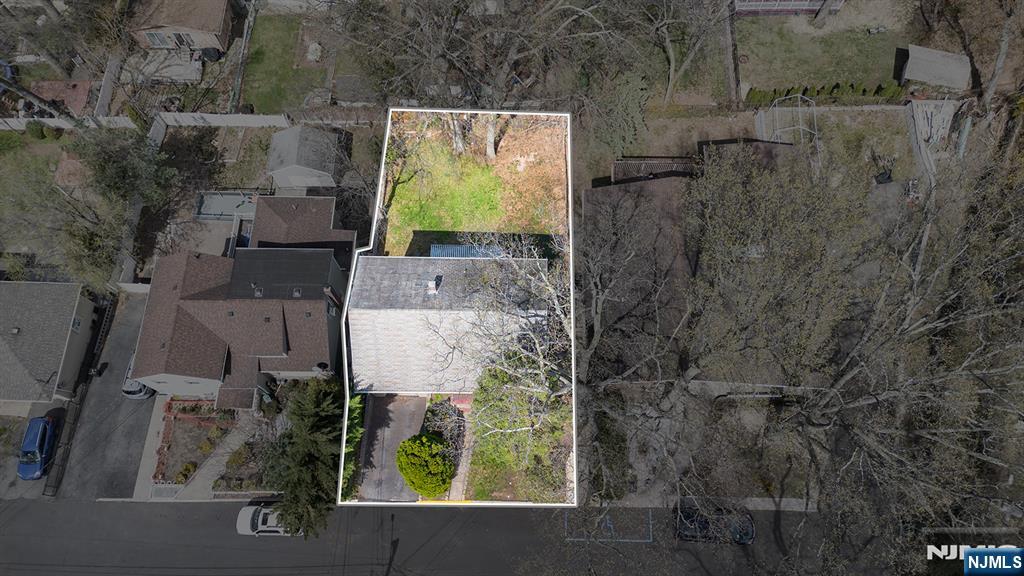 an aerial view of residential house with outdoor space