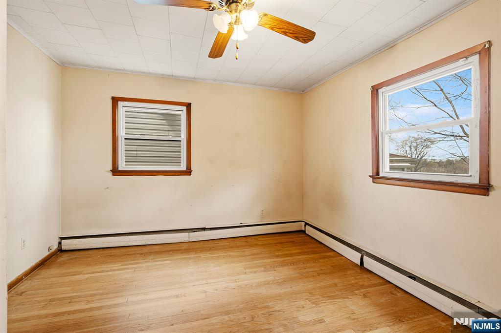 677 Greeley Avenue Fairview, NJ 07022 - Photo 14 of 34 a view of empty room with wooden floor
