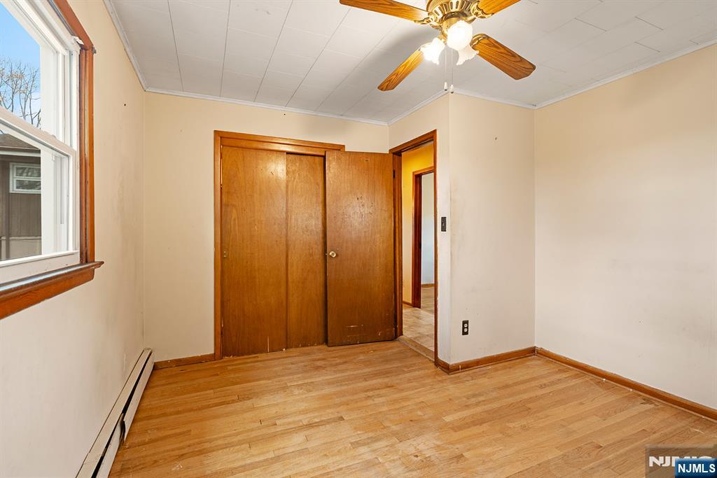 677 Greeley Avenue Fairview, NJ 07022 - Photo 15 of 34 a view of empty room with window and ceiling fan