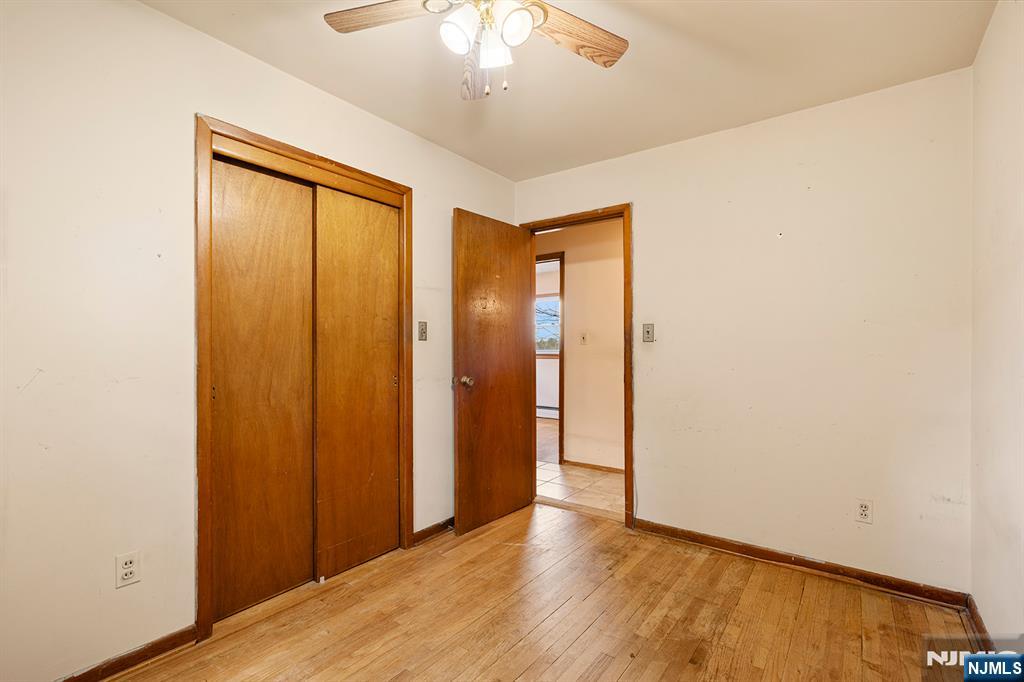 677 Greeley Avenue Fairview, NJ 07022 - Photo 17 of 34 wooden floor in an empty room