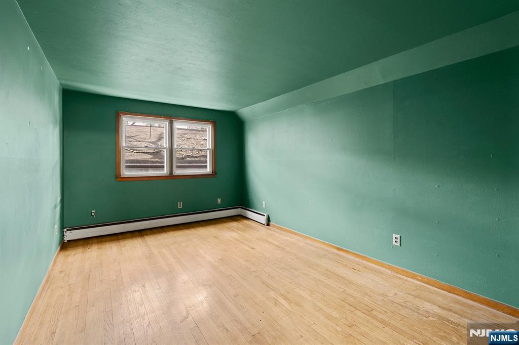 677 Greeley Avenue Fairview, NJ 07022 - Photo 19 of 34 a view of an empty room with a window