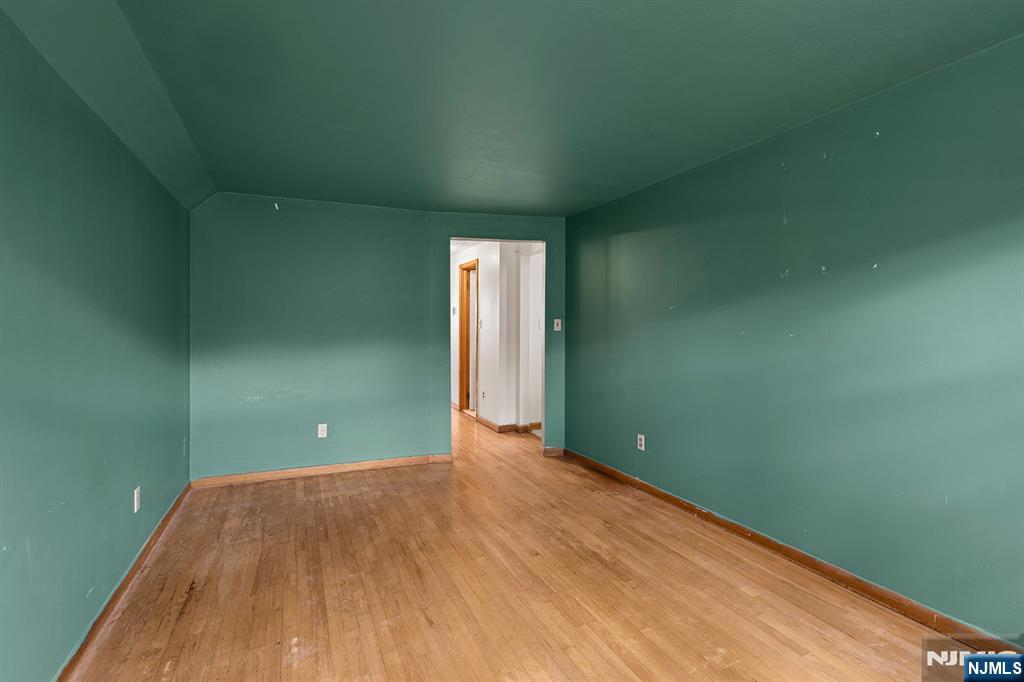 677 Greeley Avenue Fairview, NJ 07022 - Photo 20 of 34 a view of a room with wooden floor