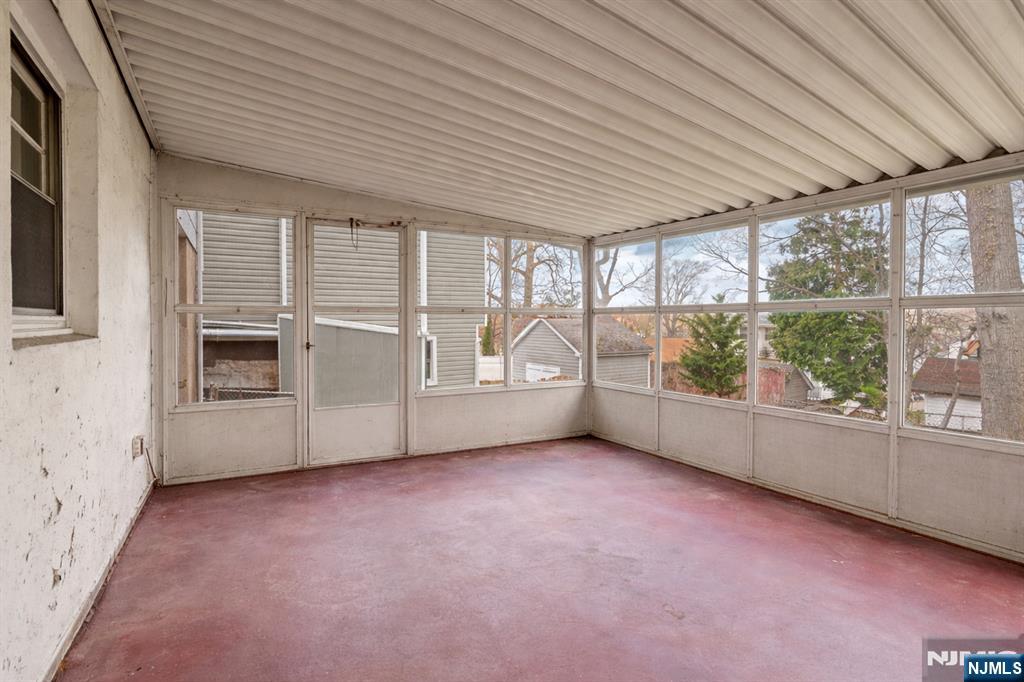 677 Greeley Avenue Fairview, NJ 07022 - Photo 30 of 34 an empty room with windows