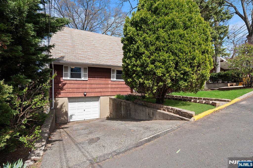 677 Greeley Avenue Fairview, NJ 07022 - Photo 3 of 34 a front view of a house with a yard