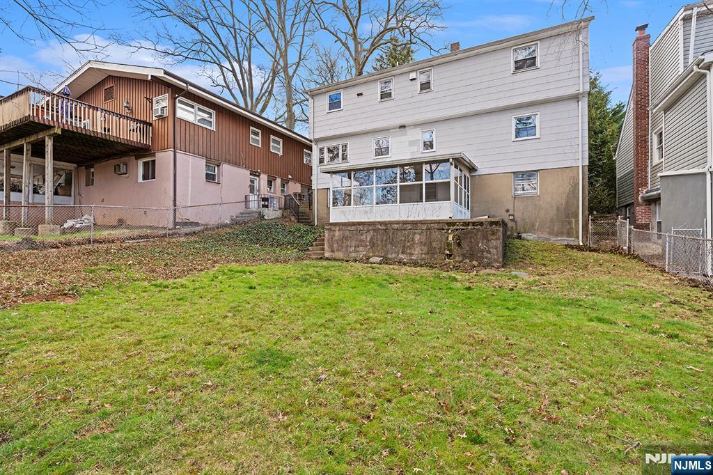 677 Greeley Avenue Fairview, NJ 07022 - Photo 31 of 34 a front view of a house with a yard