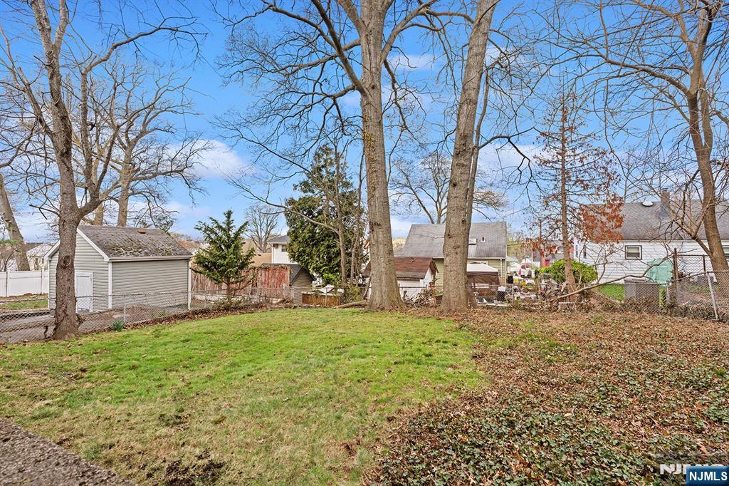 677 Greeley Avenue Fairview, NJ 07022 - Photo 32 of 34 a view of a yard with large trees