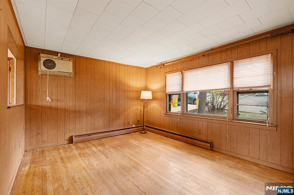 677 Greeley Avenue Fairview, NJ 07022 - Photo 5 of 34 an empty room with windows