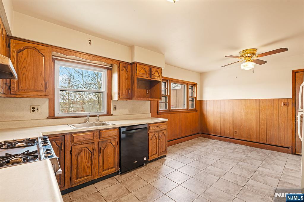 677 Greeley Avenue Fairview, NJ 07022 - Photo 7 of 34 a kitchen with a sink stove and cabinets