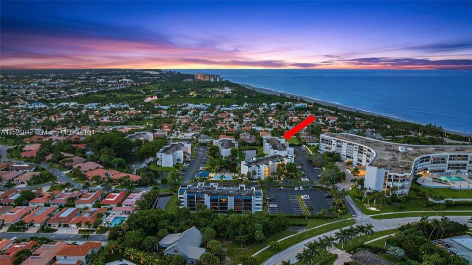 1605 Highway 1, Unit A406 Jupiter, FL 33477 - Photo 2 of 26 an aerial view of residential houses with outdoor space and trees