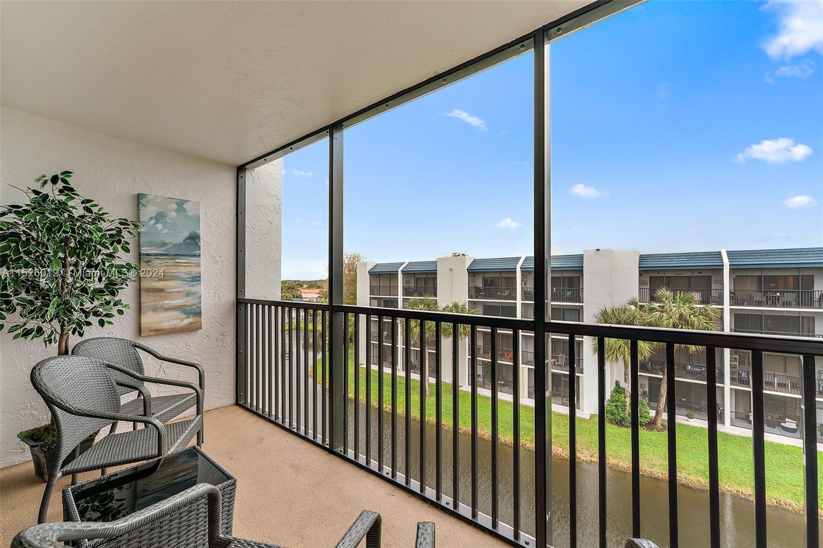 1605 Highway 1, Unit A406 Jupiter, FL 33477 - Photo 22 of 26 a view of a balcony with chairs