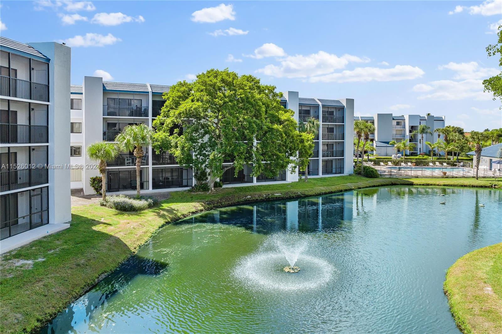 1605 Highway 1, Unit A406 Jupiter, FL 33477 - Photo 23 of 26 a view of a lake with a house