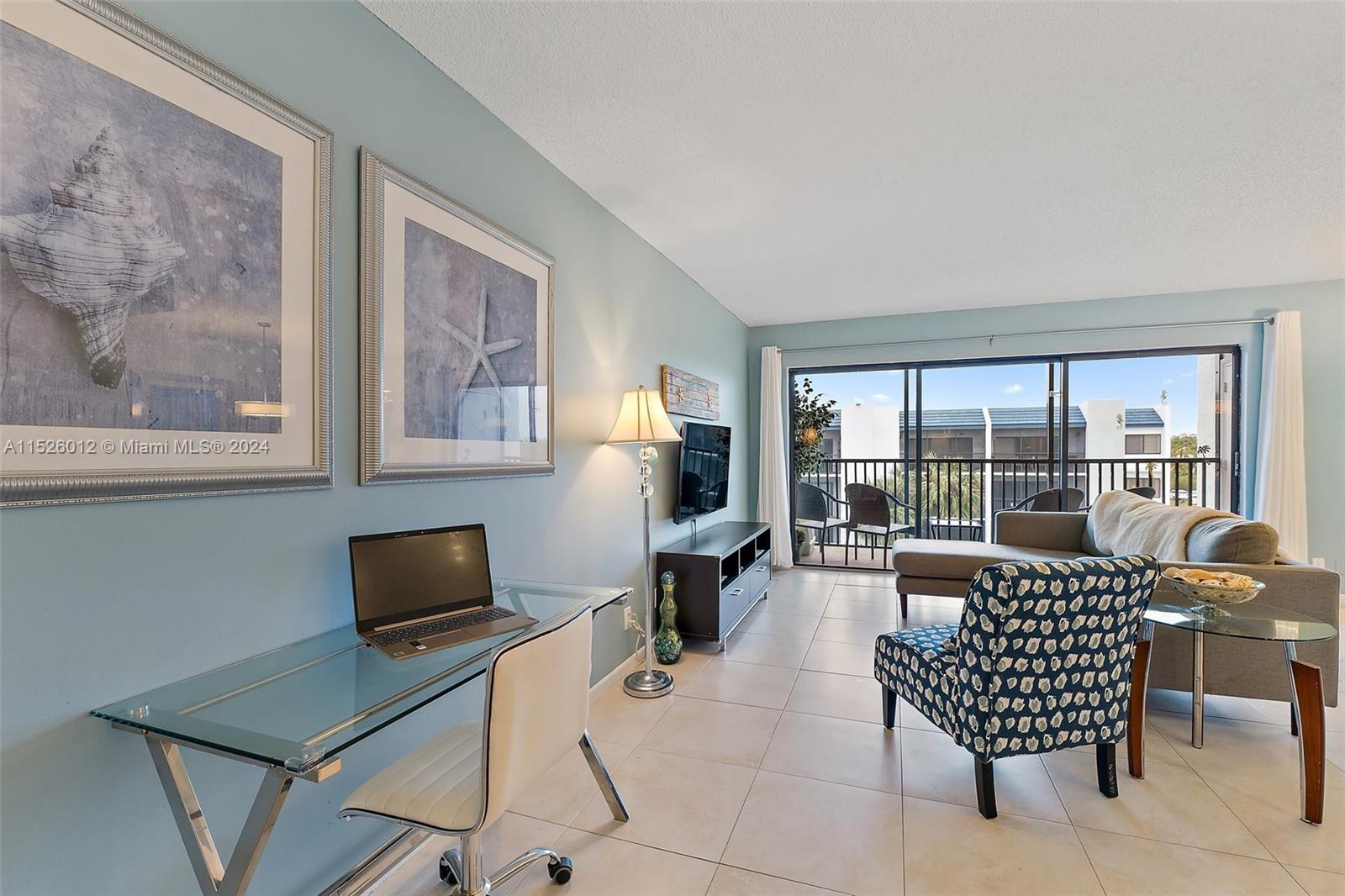 1605 Highway 1, Unit A406 Jupiter, FL 33477 - Photo 6 of 26 a work room with furniture and a potted plant