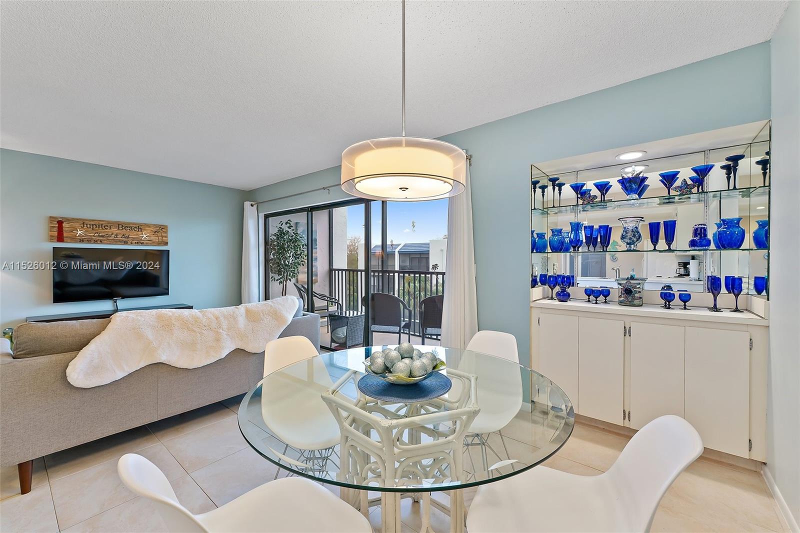1605 Highway 1, Unit A406 Jupiter, FL 33477 - Photo 10 of 26 a living room with furniture and a table