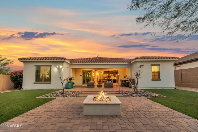 a front view of house with yard and outdoor seating