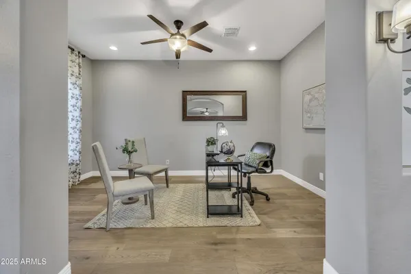 a work room with furniture and a window