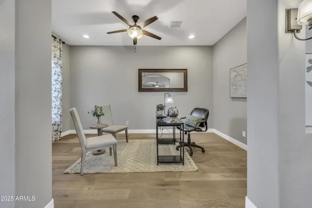 a work room with furniture and a window