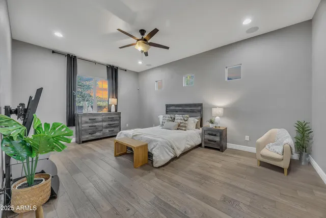 a bedroom with a bed and a couch