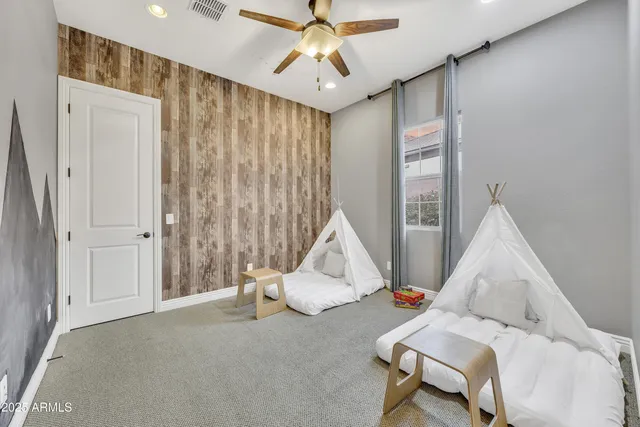 a room with furniture and white walls