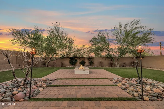 a childrens park with lots of trees and slides