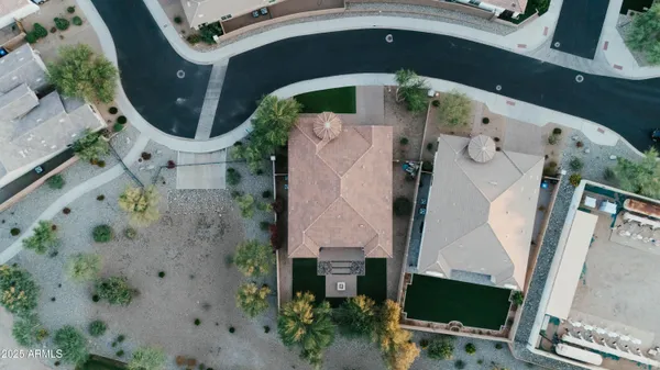 an aerial view of a house with a swimming pool