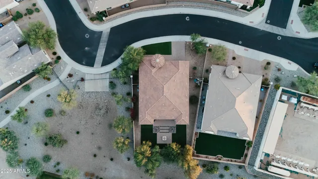 an aerial view of a house with a swimming pool
