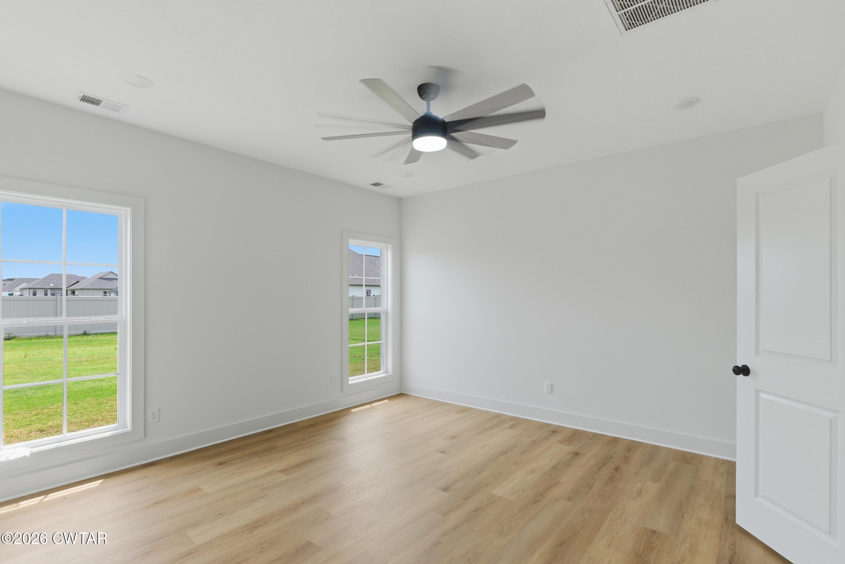 179 Daybreak Loop Medina, TN 38355 - Photo 21 of 32 wooden floor in an empty room with a window