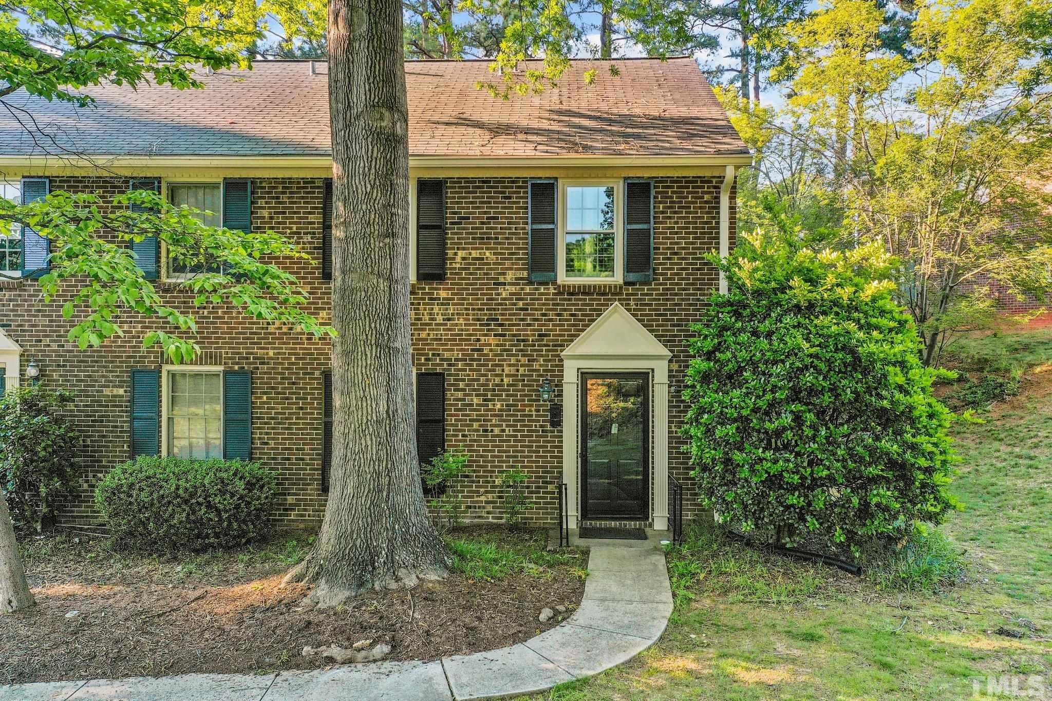 3169 Morningside Drive Raleigh, NC 27607 - Photo 1 of 36 a front view of a house with garden