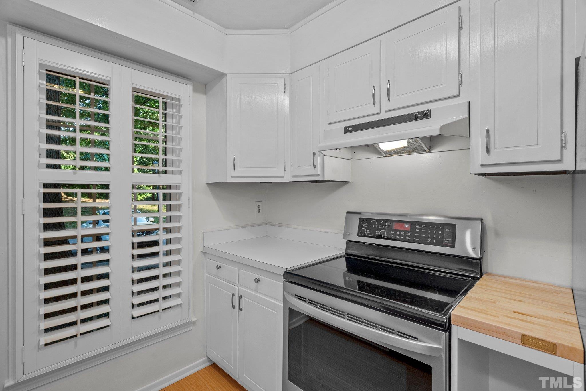 3169 Morningside Drive Raleigh, NC 27607 - Photo 16 of 36 a kitchen with appliances and cabinets