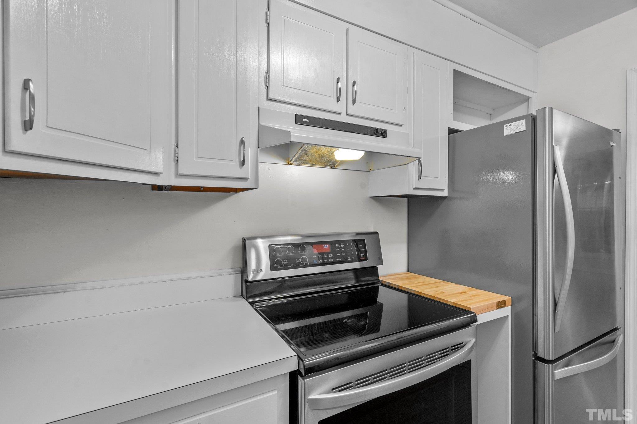 3169 Morningside Drive Raleigh, NC 27607 - Photo 17 of 36 a kitchen with cabinets and stainless steel appliances