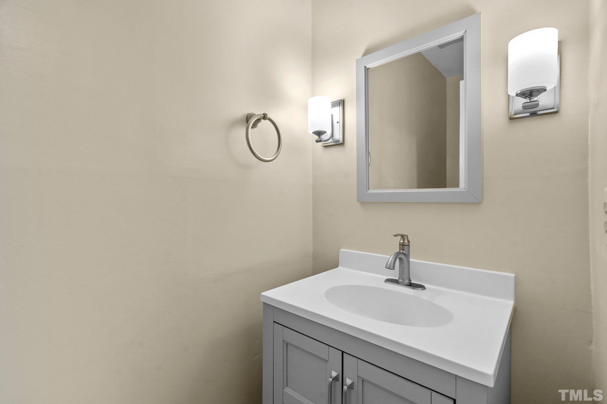 3169 Morningside Drive Raleigh, NC 27607 - Photo 18 of 36 a bathroom with a sink and mirror
