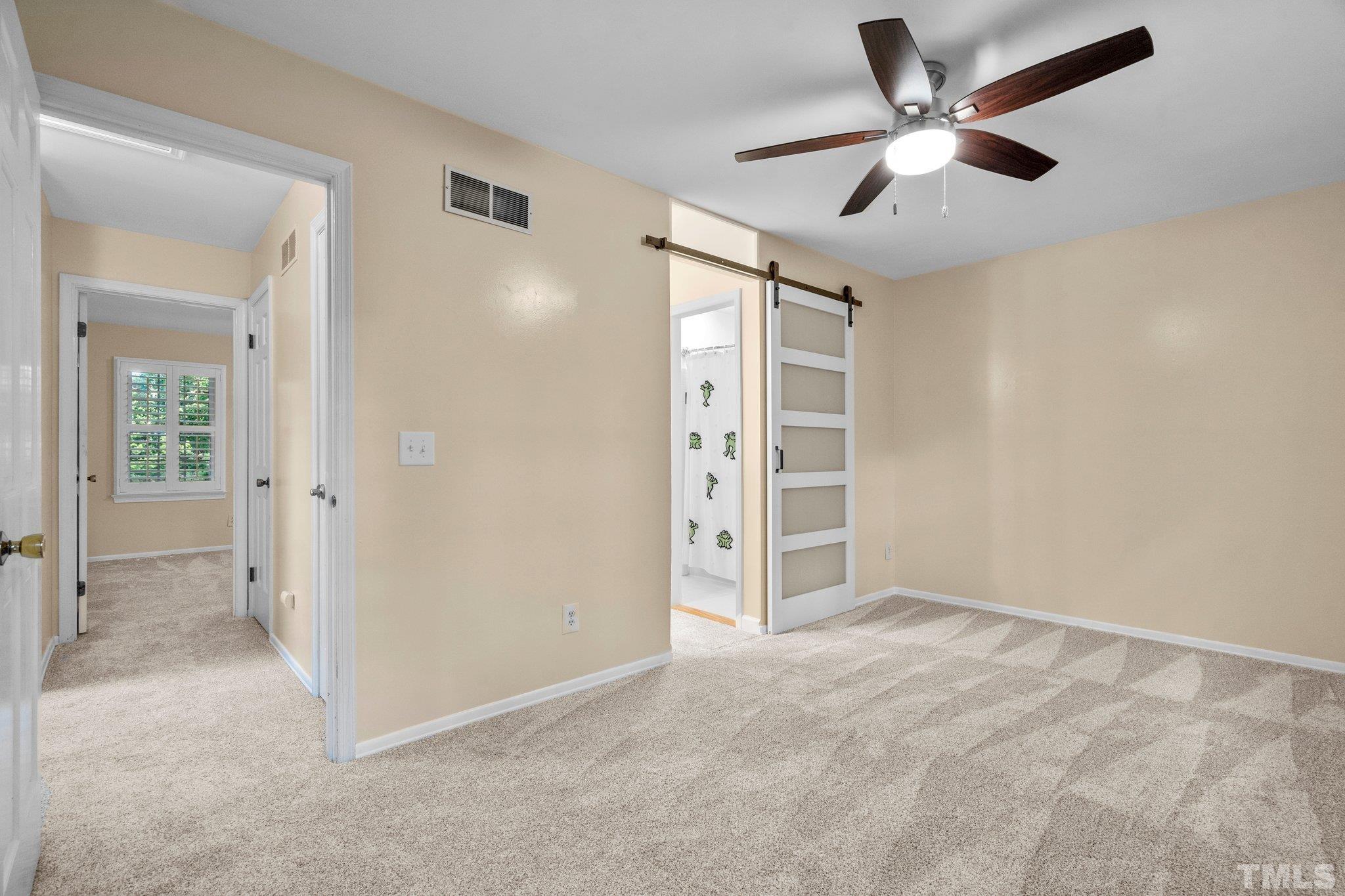 3169 Morningside Drive Raleigh, NC 27607 - Photo 28 of 36 an empty room with closet and a ceiling fan