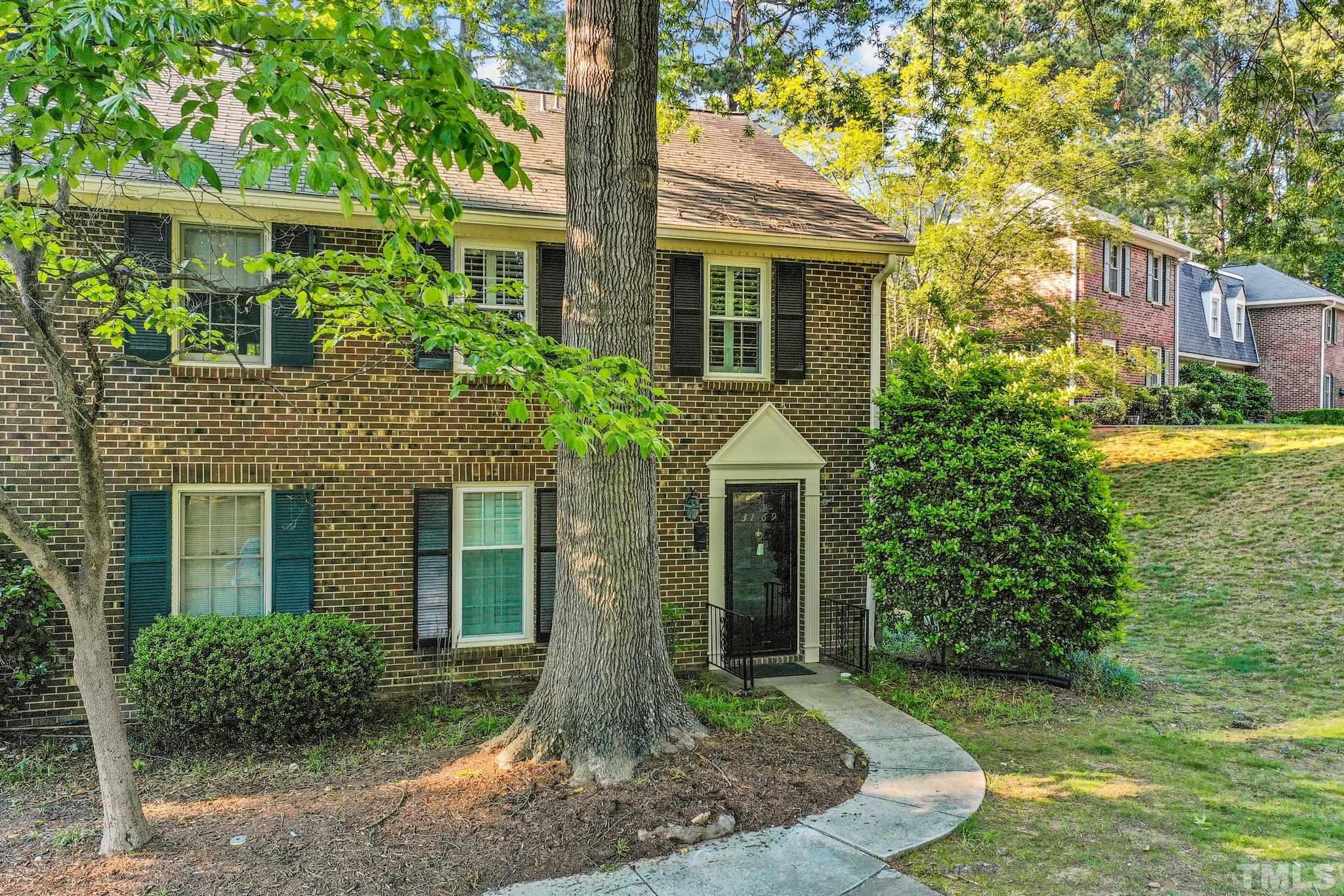 3169 Morningside Drive Raleigh, NC 27607 - Photo 3 of 36 a front view of a house with garden