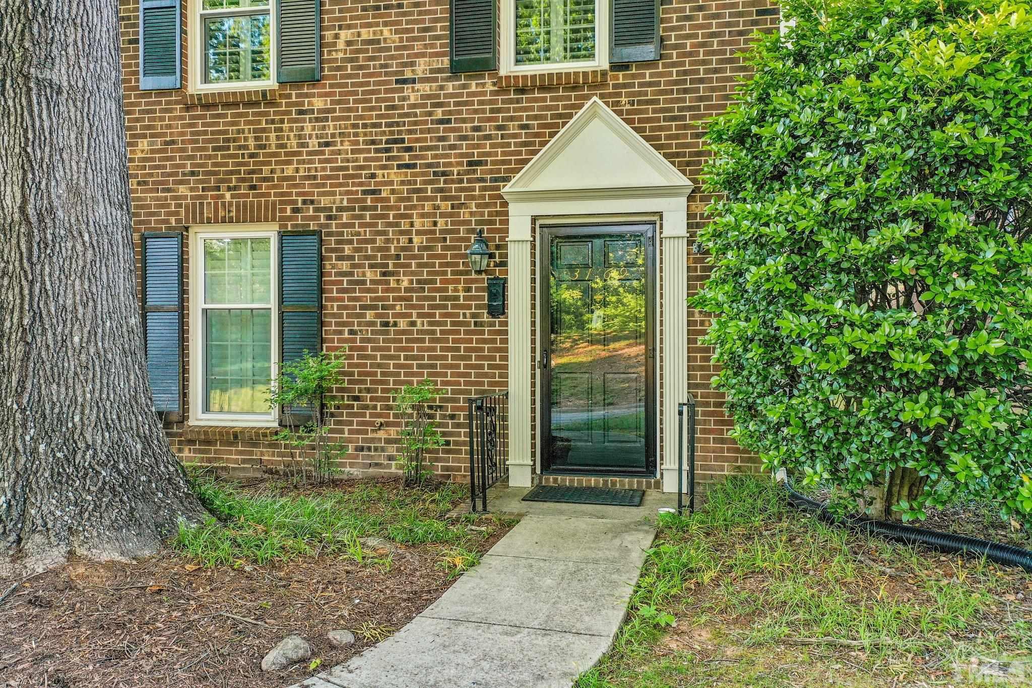 3169 Morningside Drive Raleigh, NC 27607 - Photo 4 of 36 a front view of a house with garden
