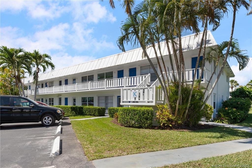 2929 Southeast Ocean Boulevard, Unit K7 Stuart, FL 34996 - Photo 1 of 18 a view of multiple houses with yard
