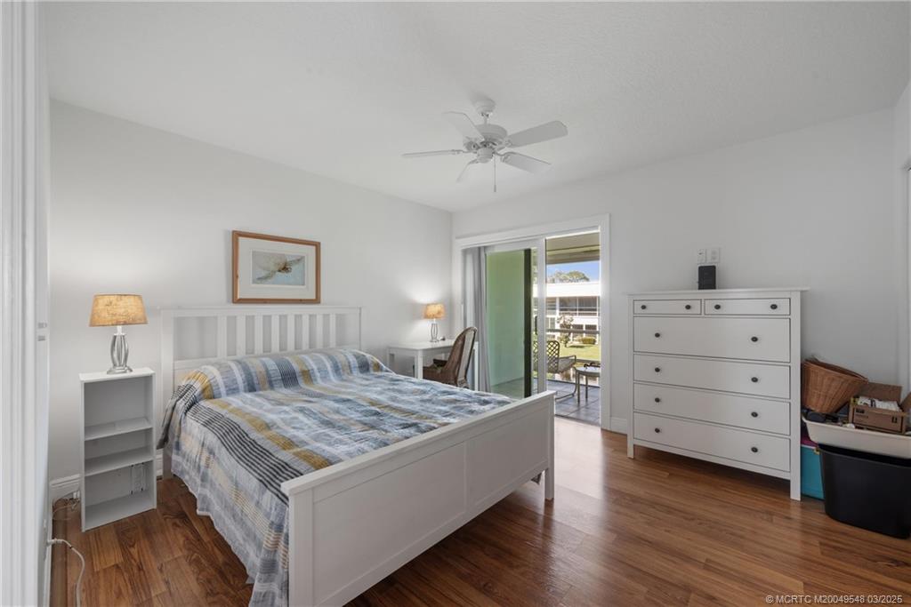 2929 Southeast Ocean Boulevard, Unit K7 Stuart, FL 34996 - Photo 13 of 18 a bedroom with a bed and a dresser